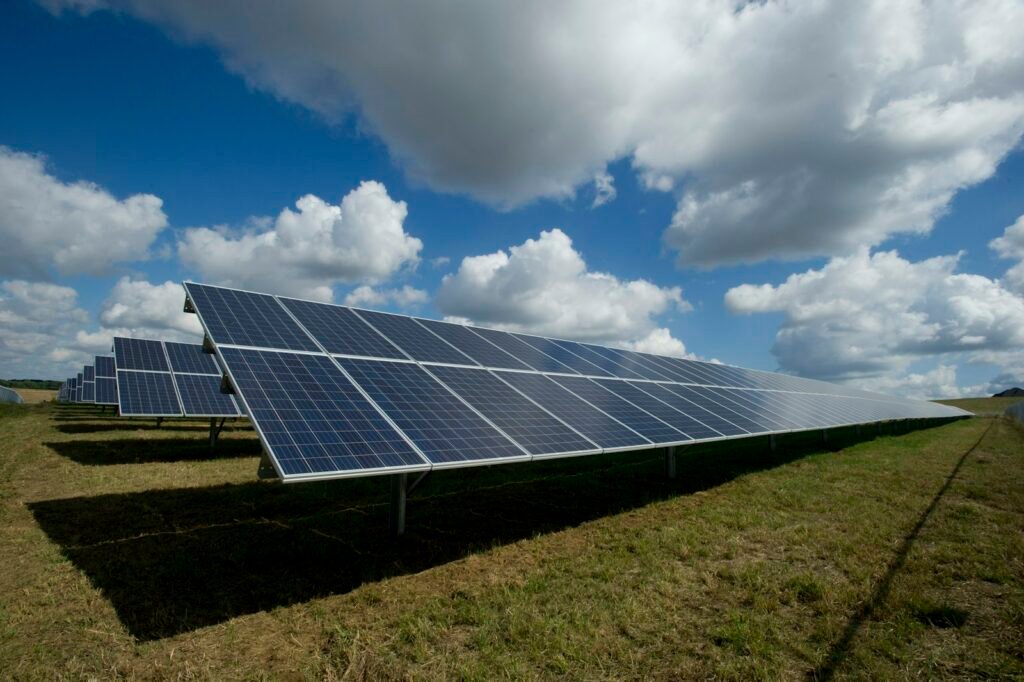 Rooftop solar panels under a bright sky